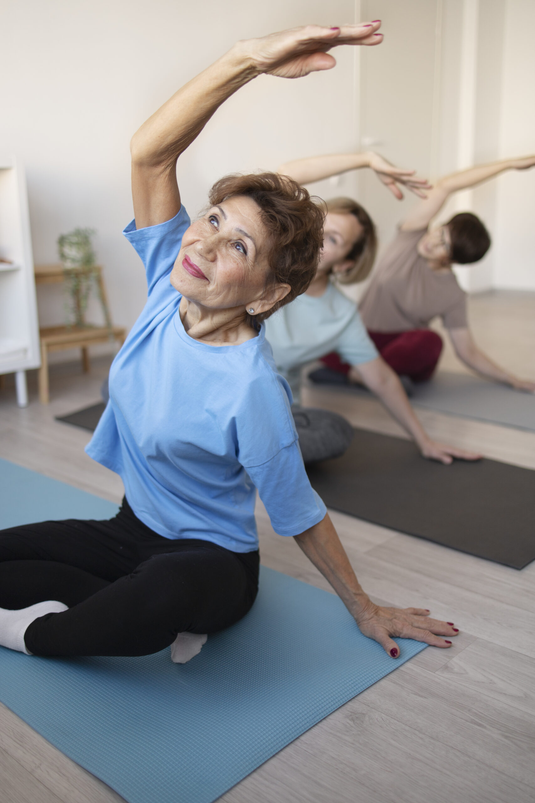 senior-women-doing-yoga-fitness-together